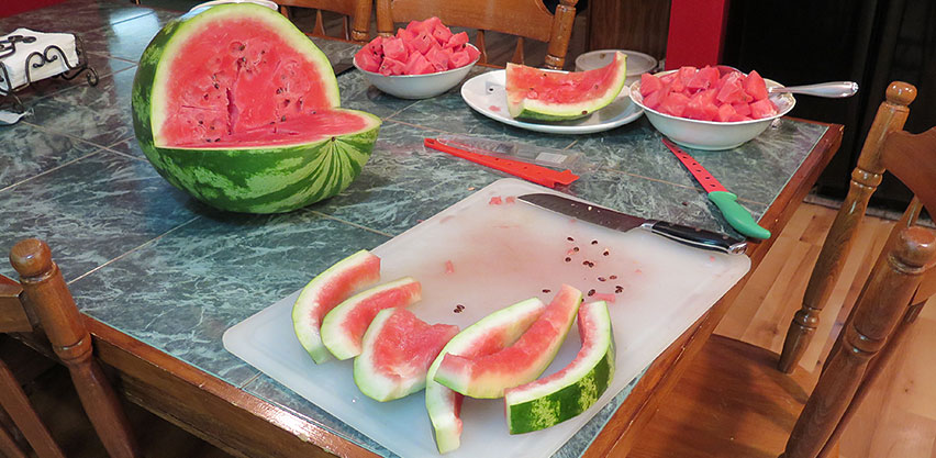 Sweet Ripe Watermelon Sliced & Cut From Rind on Kitchen Table